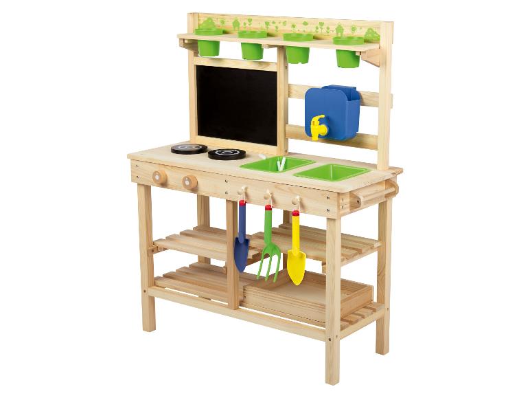 Cuisine en bois pour enfants avec évier, cuisinière et rangement.