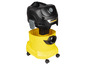 Un aspirateur Karcher noir avec un bac jaune et des roulettes.