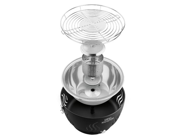 Barbecue portable démonté avec des composants en acier inoxydable et un boîtier noir.
