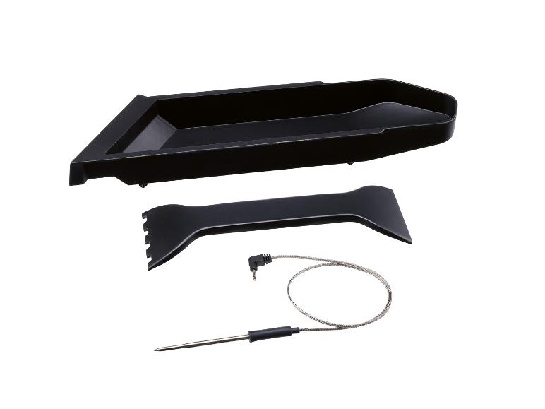 Zwarte grillplaat, spatel en vleesthermometer