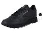 Zwarte sportschoenen met witte en grijze kleurkeuzecirkels.