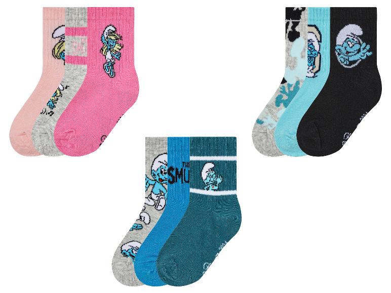 Trois paires de chaussettes Smurfs dans différents coloris et motifs.