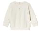 Een witte longsleeve met knopen voor baby's.