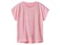 T-shirt rose à manches courtes avec des pois blancs.
