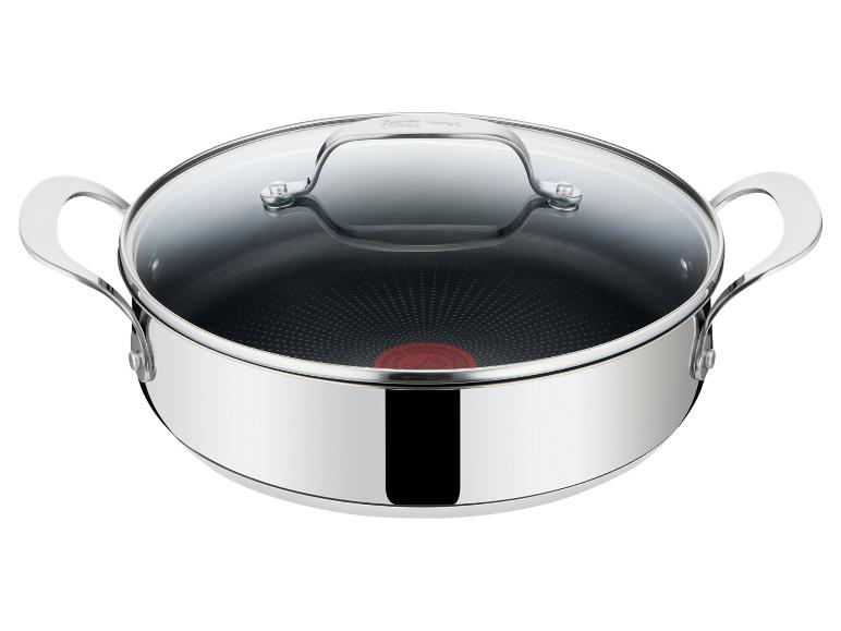 Marmite de cuisson en acier inoxydable avec couvercle en verre et poignées latérales.
