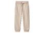 Pantalon de jogging beige avec cordon de serrage à la taille et poignets côtelés.