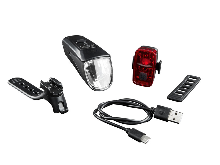 Een set met een witte koplamp, een rode achterlicht en accessoires voor fietsen
