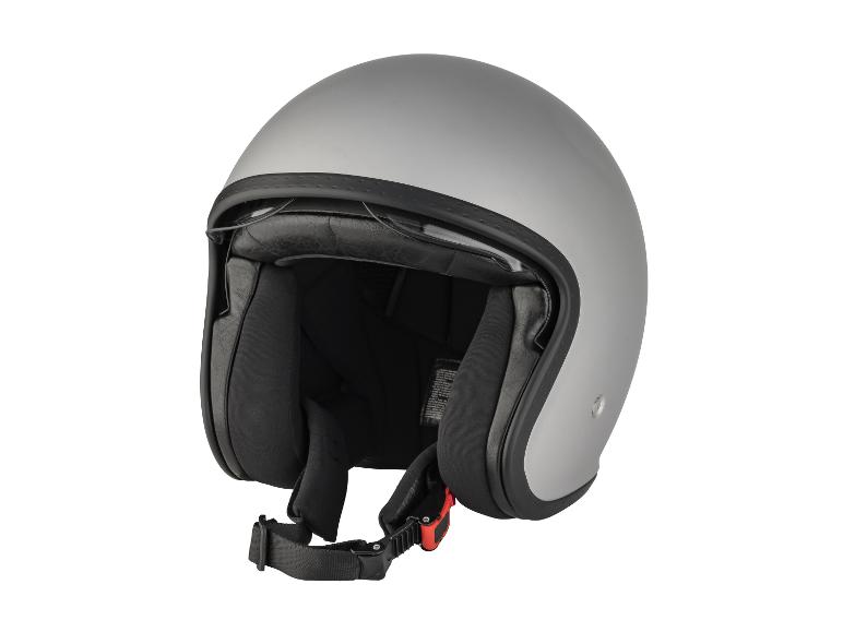 Un casque de moto gris avec une visière et une mentonnière noires.
