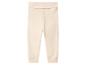Lichtbeige babybroek met geribbelde tailleband en boorden