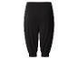 Zwarte broek met elastische tailleband en boorden bij de enkels.