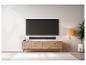 Een zwarte soundbar onder een tv op een houten tv-meubel.