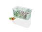 Een groene plastic opbergdoos met deksel, gevuld met fruit.