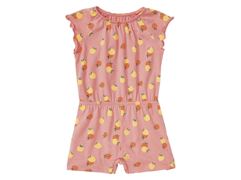 Une combinaison rose à manches courtes avec un motif de citrons.