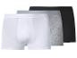 Trois boxers pour hommes en blanc, gris et noir.