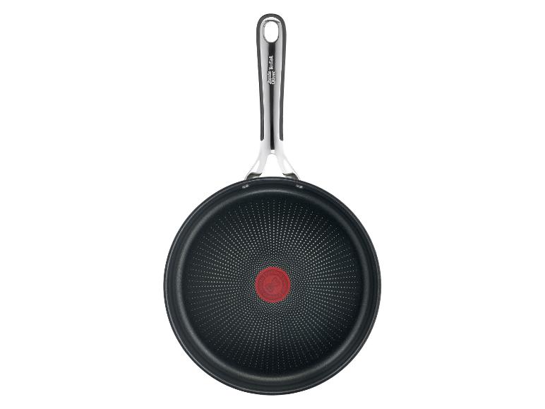 Poêle noire Jamie Oliver Tefal avec une poignée en métal et un indicateur de température rouge