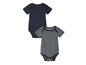 Twee babypakjes: één effen donkerblauw en één met witte strepen.