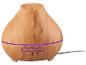 Diffuseur d'huiles essentielles en bois clair avec bande lumineuse violette et boutons de minuterie