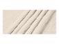 Tissu en mousseline de coton froissé de couleur beige clair.