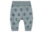 Pantalon bébé avec motif de lions.