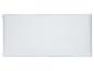 Oreiller blanc rectangulaire avec un motif matelassé en losanges.