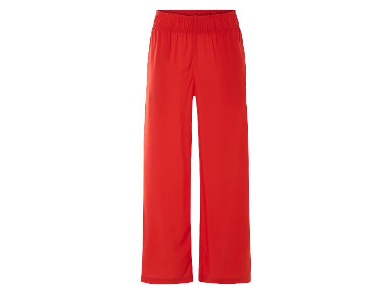 Pantalon rouge ample, style décontracté.
