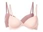 Twee beha's in roze en beige kleuren.