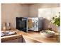 Zilveren SILVERCREST® magnetron SMW 700 D4 met open deur op een aanrecht.