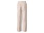 Lichtbeige wijde broek met plooien en een achterzak.
