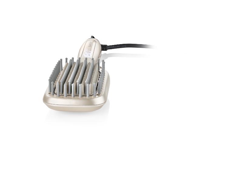 Une brosse à cheveux BaByliss rose avec des poils ronds