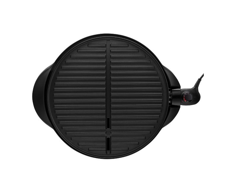 Ronde, zwarte elektrische grillplaat: perfect voor grillen.