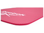 Een roze fitnessmat van Reebok met een geribbeld oppervlak.