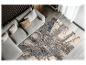 Tapis moderne gris et beige dans un salon contemporain.