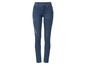 Donkerblauwe skinny jeans met gaten.