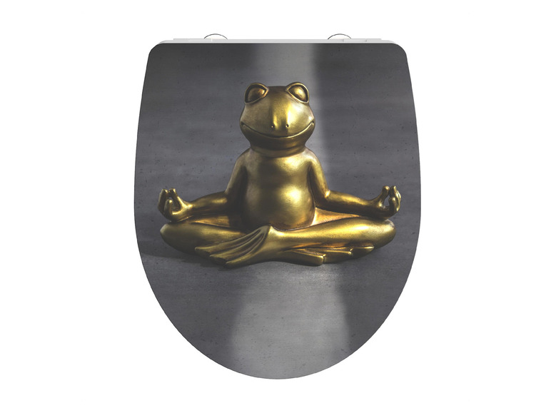 Un abattant de WC avec une grenouille dorée en position de lotus.