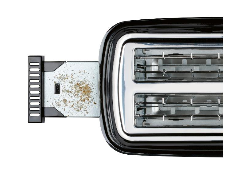 Een zwarte broodrooster met twee gleuven en broodkruimels.