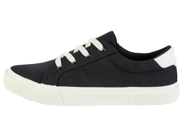 Zwarte canvas sneakers, witte veters, crèmezool.
