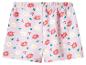 Short rose avec imprimé floral de marguerites blanches et roses.