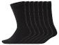 Six chaussettes noires unies, pliées, avec des poignets côtelés et des détails blancs à l'intérieur