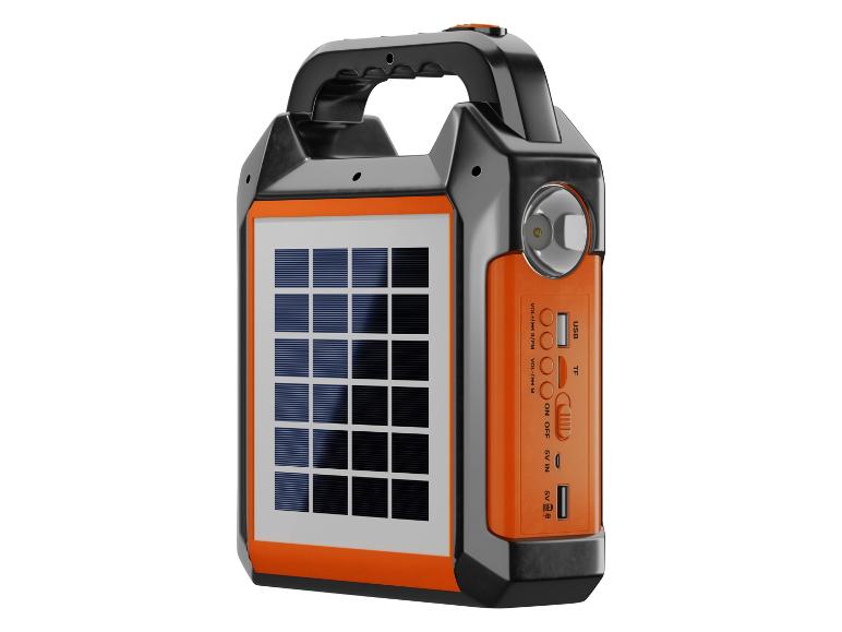 Lampe de camping portable orange et noire avec panneau solaire, ports USB et commandes.