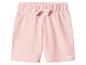 Short en jersey rose avec taille élastique et nœud décoratif.