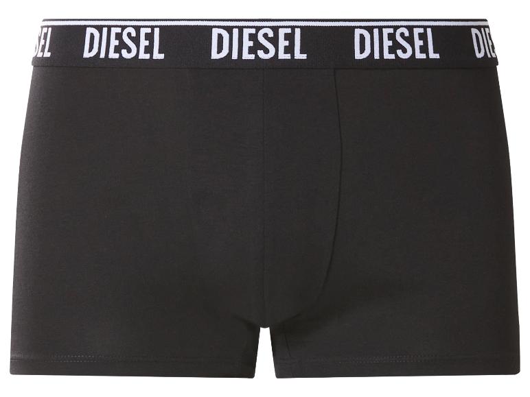Zwarte herenboxershorts met witte tekst op de tailleband.