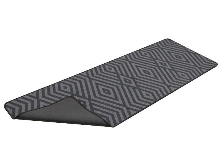Gangloper met een grijs geometrisch ruitpatroon, met de antislip onderkant zichtbaar.