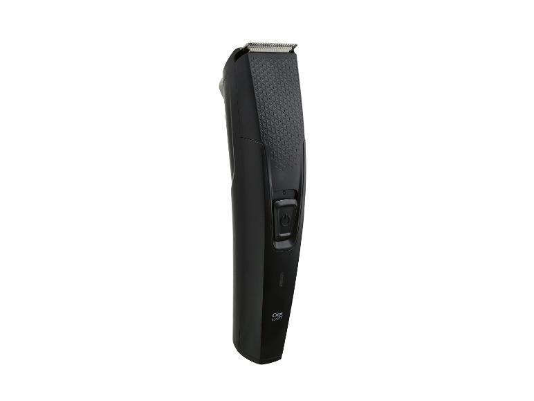 Tondeuse à cheveux et barbe noire avec poignée texturée et bouton d'alimentation