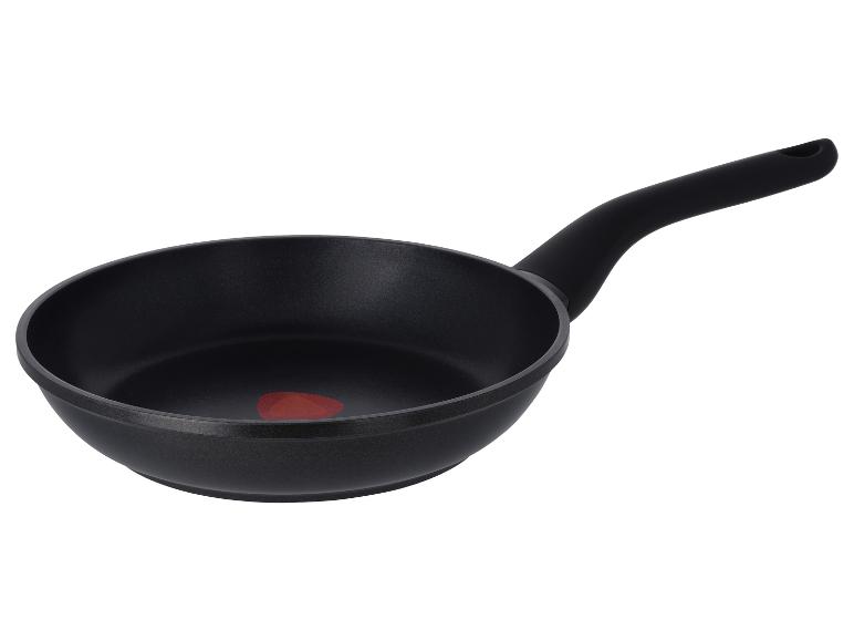 Poêle à frire noire avec revêtement antiadhésif et indicateur de chaleur rouge