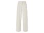 Beige pantalon met plooien.