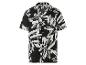 Chemise à manches courtes à motif floral noir et blanc.