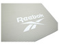 Een beige Reebok yogamat met een geribbelde textuur.