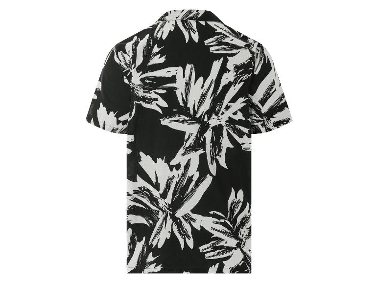 Chemise à manches courtes à motif floral noir et blanc.