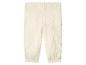 Pantalon bébé en mousseline crème avec taille et chevilles élastiquées.