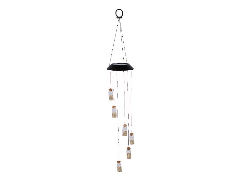 Mobile solaire avec petits flacons de sable.